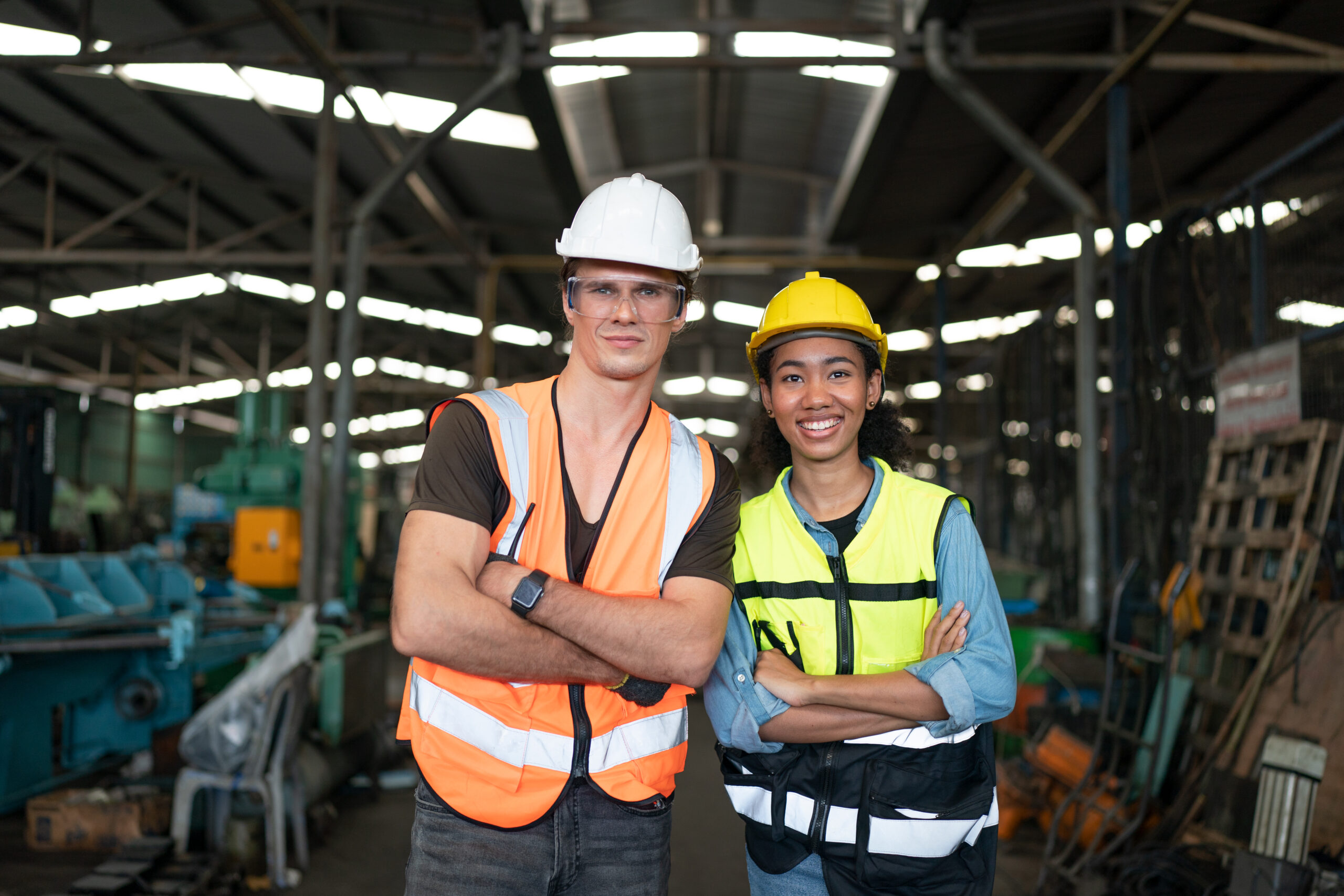 Man is working at the busy metal factory. factory worker wearing uniform in a large heavy metal factory.